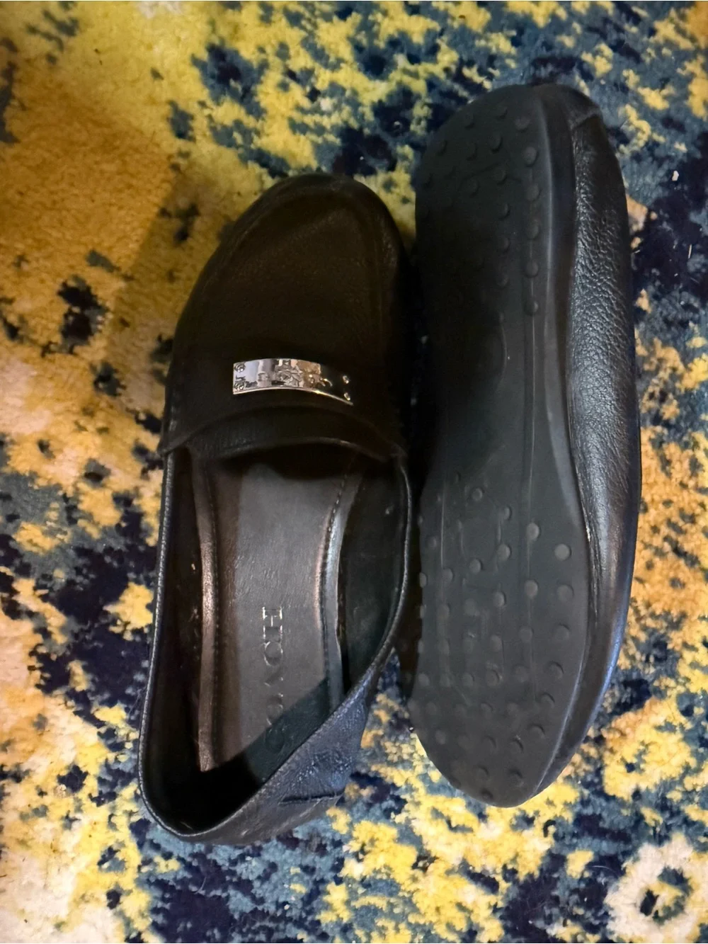 Coach Black Leather Slip-On Loafers with Silver Plaque